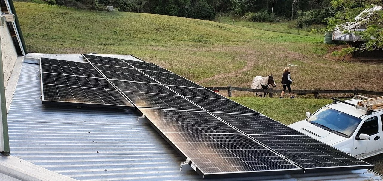 Photo of solar panels on the roof of a country house