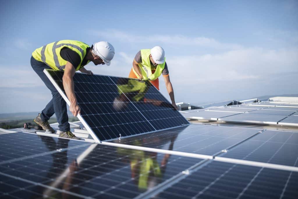 Professional electricians installing solar panels in South Brisbane